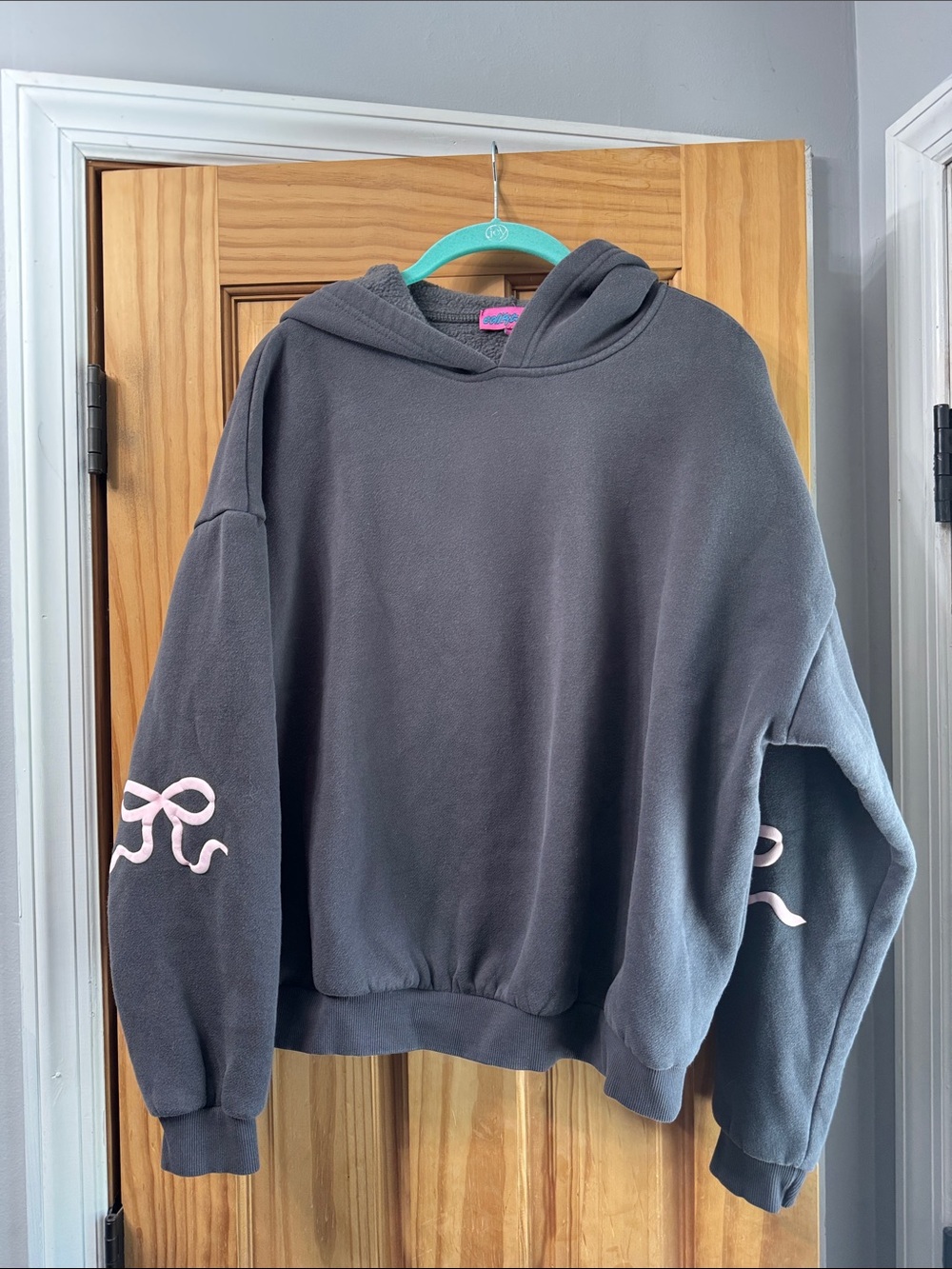 Edikted Charcoal Gray Hoodie Sweater with Pink Bow Accents